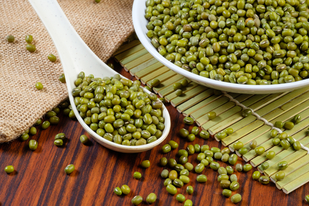 Mung beans on wooden tableの写真素材