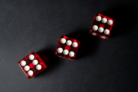 Red Sic Bo dice with black backgroundの写真素材