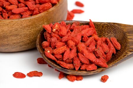 Dried goji, goji berry or wolfberry on wooden spoon as one of the famous antioxidant superfoodの写真素材