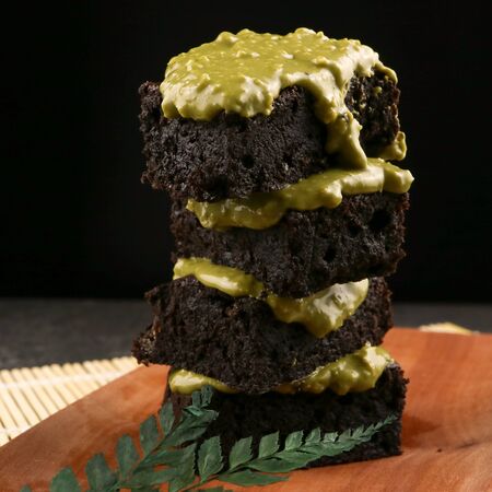 fleshly baked matcha brownies on wooden backgroundの写真素材