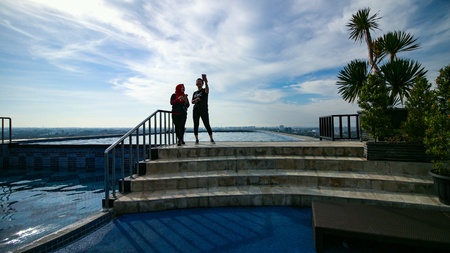Take a selfie at swimming poolの素材