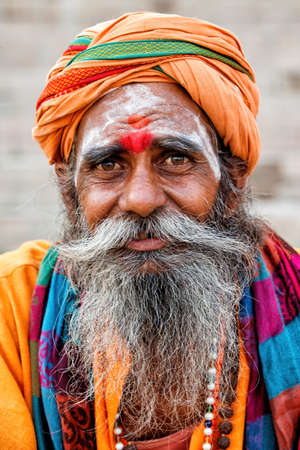 Varanasi, India - April 17, 2018: Old saddhu (religious ascetic and holy person in Hinduism and...