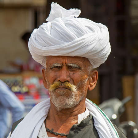 Jodhpur, Rajasthan, India - February 23, 2015: Portrait of an old man in the streets of Jodhpur with a traditional turbanのeditorial素材