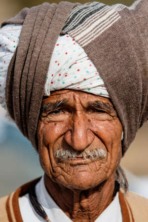 Jodhpur, Rajasthan, India - February 23, 2015: Portrait of an old man in the streets of Jodhpur with a traditional turbanのeditorial素材