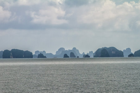 Halong Bay, Vietnam. View from a boat in the bay of Halong. In the bay are thousands of islands of limestone with beautiful shapes.の写真素材