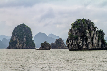Halong Bay, Vietnam. View from a boat in the bay of Halong. In the bay are thousands of islands of limestone with beautiful shapes.の写真素材