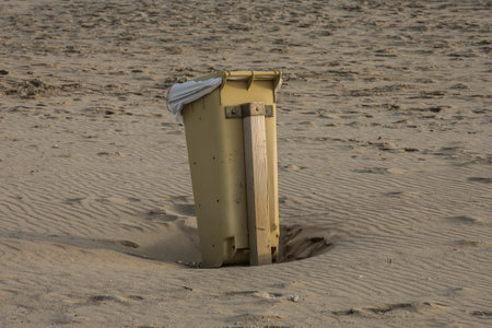 Beach in the Netherlands with a yellow container on the sand.の写真素材
