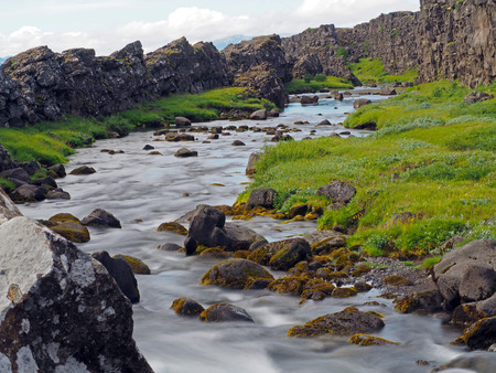 melted  river in the Thingvellir national park in Mid-Atlantic Ridgeの写真素材