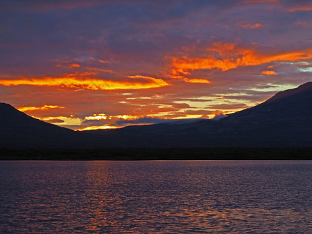 beautiful red low clouds sunset on thingvellir lake - Icelandの写真素材