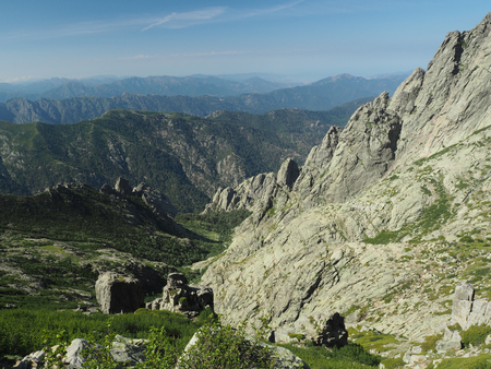 high mountain view scenery with sharp boulders nad blue skyの写真素材