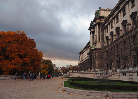Autumn street view with SchÃ¶nbrunn Castle in Vienna in cloudy eveningのeditorial素材