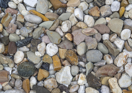 Small multi color pebbles stones backgroundの写真素材