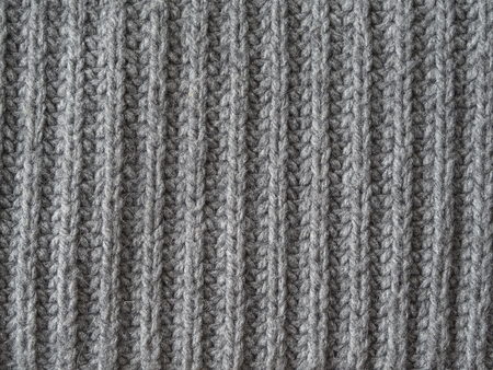 grey wool hand knitted texture abstract backgroundの写真素材