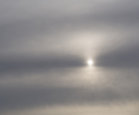 misty faded sun light gray pink blue sky backgroundの写真素材