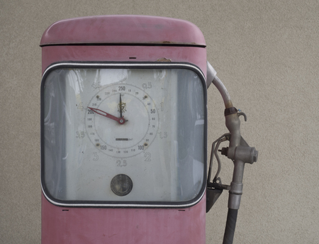 Czech Republic,Prague, April 15, 2018: close up pink retro pumping unit of petrol station from fifties, beige wall backgroundのeditorial素材