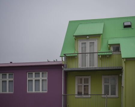 Iceland, Reykjavik, July 30, 2019: street in Reykjavik center with old historic pink and green sheet metal houses.のeditorial素材