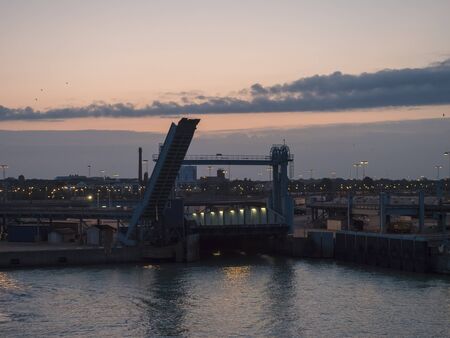 TRELLEBORG, SWEDEN - August 21, 2019: Night view of Trelleborg harbor with Baltic ferry boats, Swedish port, blue hour evening.のeditorial素材