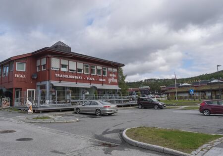 Dombas, Norway, September 7, 2019: Grill house and pizza restaurant red building in cener of small town Dombas. Central Norway.のeditorial素材