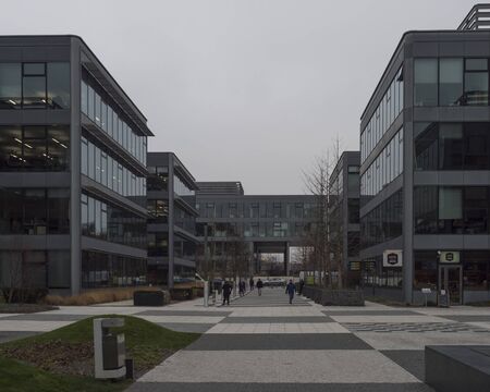 Prague, Czech Republic, December 5, 2019: street view of Chodov business center, The park. Busy modern quarter with people and buildings from steel and glass. Moody winter dayのeditorial素材