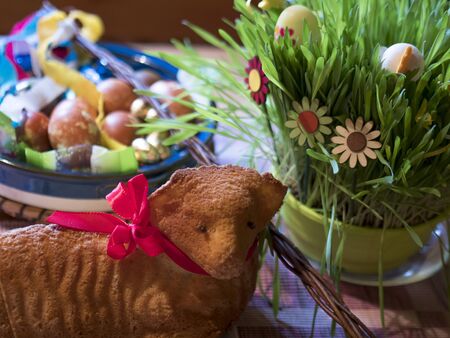 Homemade Paschal lamb cake and Colorful Painted easter eggs and Pomlazka - traditional braided whip...