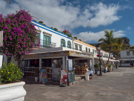 Puerto de Mogan, Gran Canaria, Canary Islands, Spain December 18, 2020: Traditional colorful houses at pedestrian street of small fishing village port Puerto de Mogan, favorite tourist place.のeditorial素材