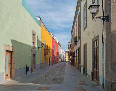 Las Palmas de Gran Canaria, Canary Islands, Spain December 23, 2020: Pedestrian street of beautiful historic old town Vegueta. Houses with colorful facades and traditional wooden balcony.のeditorial素材