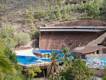 San Bartolome de Tirajana, Gran Canaria, Canary Islands, Spain December 18, 2020: the terraces of Dolphinarium at Palmitos Park, small group of people waiting for dolphins show. Gran Canaria, Spainのeditorial素材