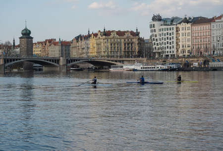 Prague, Czech Republic, March 26, 2021: View of Rasinovo nabrezi riverbank from Vltava river with...