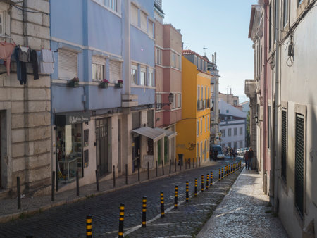Lisbon, Portugal, October 24, 2021: View of narrow Lisbon street at medieval quarter Alfama at Santa Maria Maior district.のeditorial素材