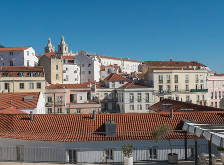 Lisbon, Portugal, October 24, 2021: View from Largo das portas do sol square at roofs of medieval quarter Alfama in Lisbon, sunny day, blue sky.のeditorial素材