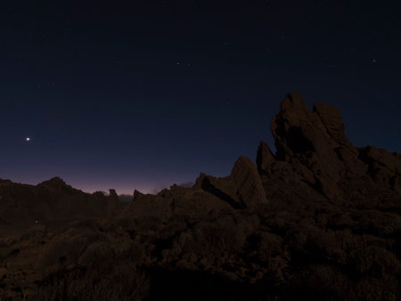 Long exposure night shot of Roques de Garcia volcanic rock formation at El Teide national park,...