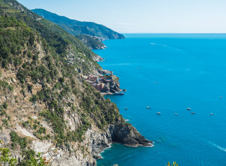Picturesque distant view of Vernazza with harbor and Castle Doria, seen from Azure Trail to...