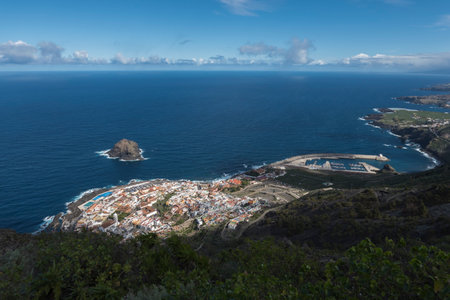 Aerial view of old town Garachico from Mirador de Garachico view point. Colorful houses and harbor. Ocean shore with lava rock pools. Popular tourist destination, Tenerife Canary Islands.の写真素材