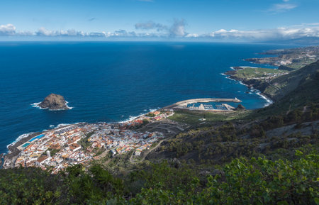 Aerial view of old town Garachico from Mirador de Garachico view point. Colorful houses and harbor. Ocean shore with lava rock pools. Popular tourist destination, Tenerife Canary Islands.の写真素材