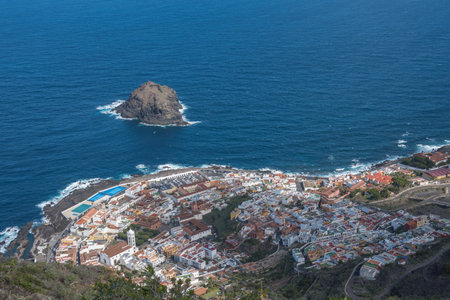 Aerial view of old town Garachico from Mirador de Garachico view point. Colorful houses and harbor. Ocean shore with lava rock pools. Popular tourist destination, Tenerife Canary Islands.の写真素材