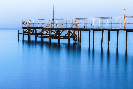 A large cloud of misty an empty dock in the morningの写真素材