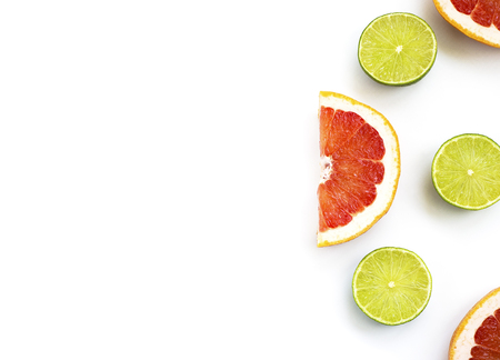 cut lime and grapefruit on a white backgroundの写真素材