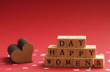 happy womens day folded from wooden cubes with letters 4の写真素材