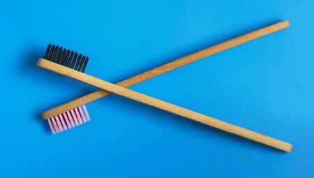 eco natural bamboo toothbrushes on blue background. zero waste flat lay 10