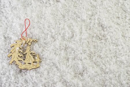 Christmas tree decorations on snow backgroundの写真素材