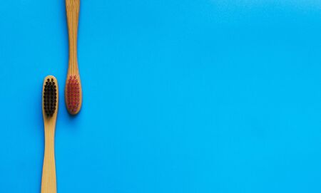 eco natural bamboo toothbrushes on blue background. zero waste flat lay. 2の写真素材