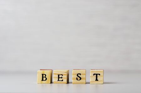 the word best made of letters on wooden cubes