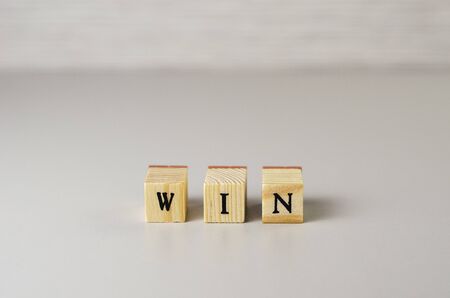 the word win made of letters on wooden cubes 3