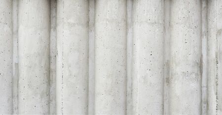 gray concrete wall in the form of columnsの写真素材