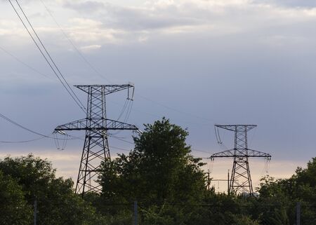 Pillar and power lines against a cloudy sky 3の写真素材