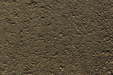 Closeup of an asphalt road textured gray backgroundの写真素材
