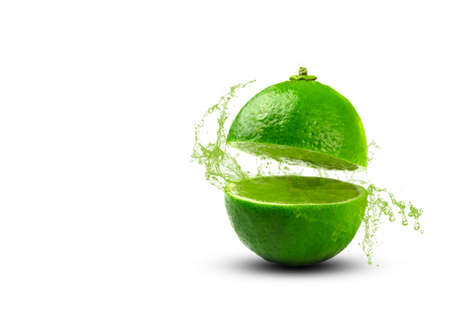 lime cut in half with a spray of juice