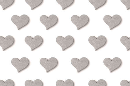 wooden heart pattern with shadow on white background 3の写真素材