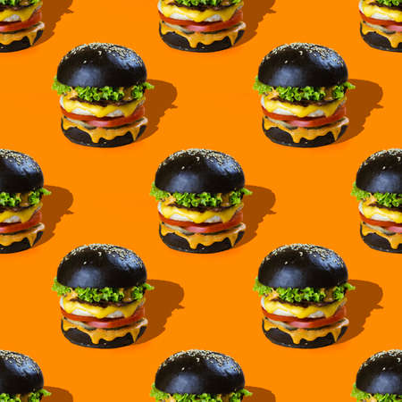 burger pattern on orange backgroundの写真素材