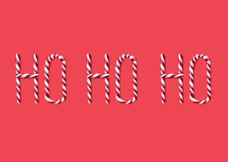 ho ho ho made from sweet caramel canes, candies on red backgroundの写真素材